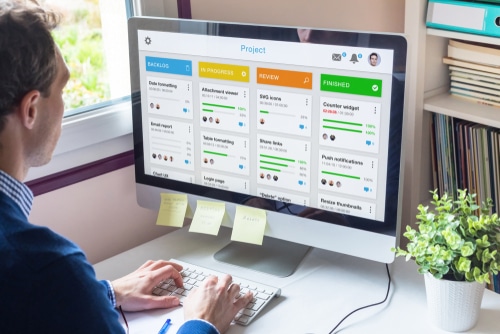 Worker managing requirements and defining project scope